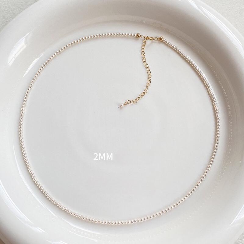 Necklace is round white necklace