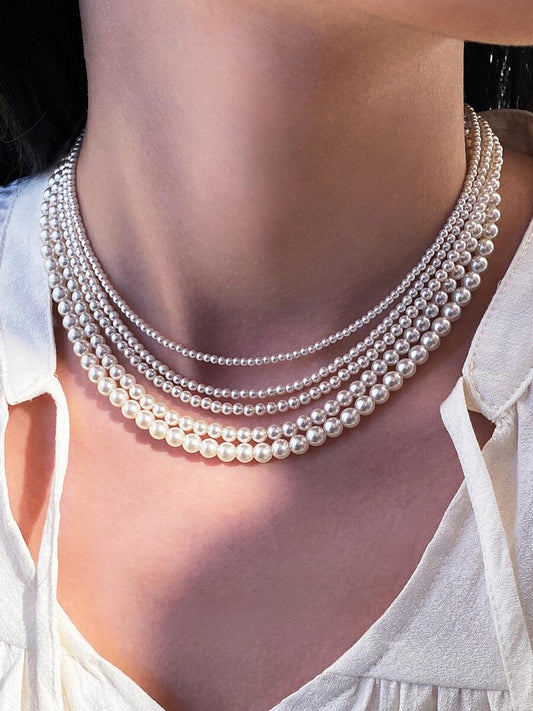 Necklace is round white necklace