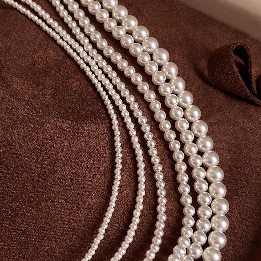 Necklace is round white necklace
