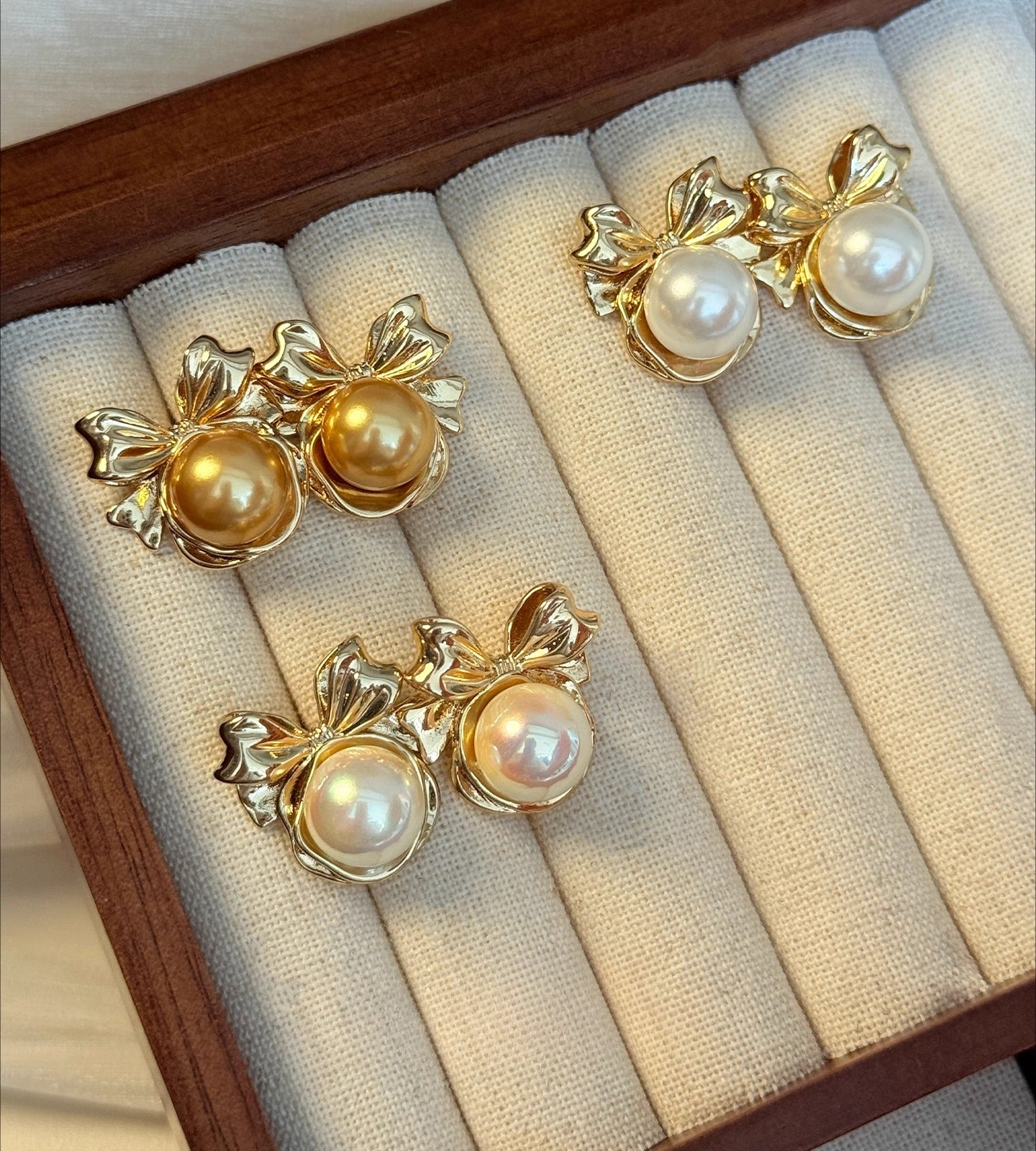 High-End Light Luxury White Pearl Bow Stud Earrings for Women - 2025 Collection
