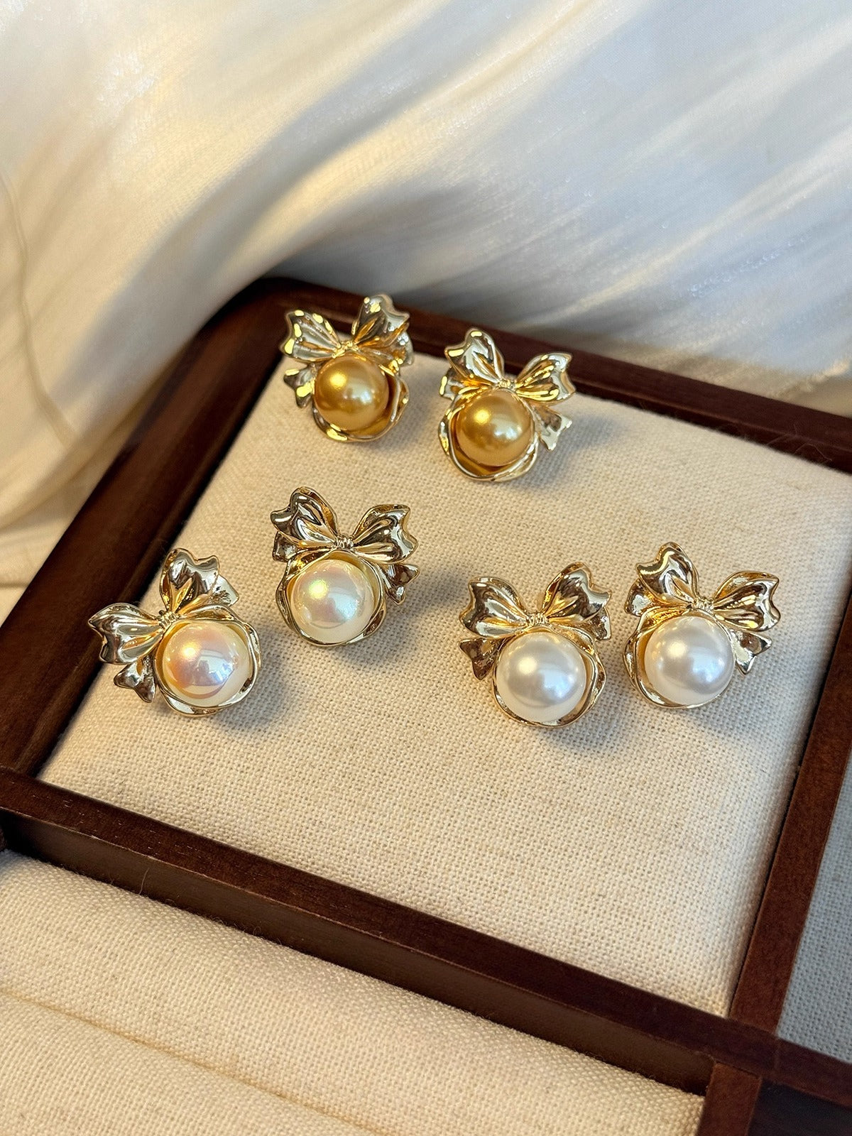 High-End Light Luxury White Pearl Bow Stud Earrings for Women - 2025 Collection