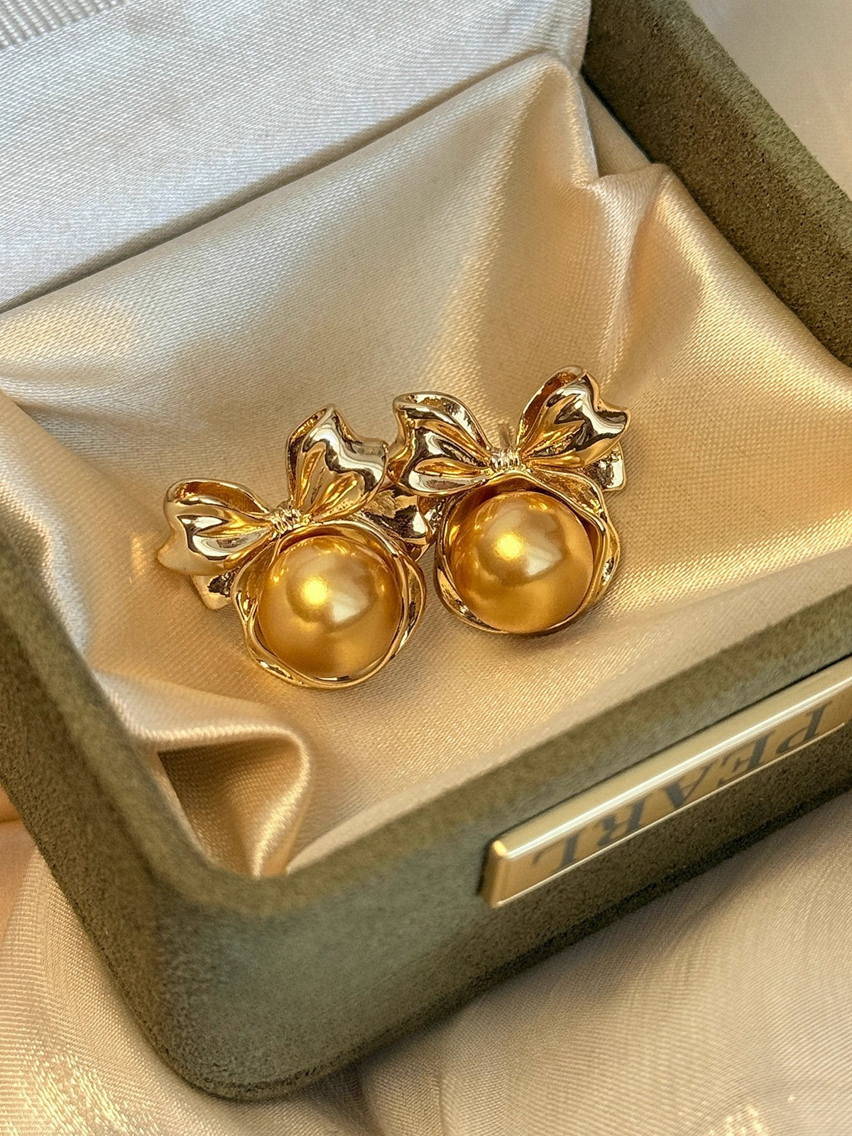 High-End Light Luxury White Pearl Bow Stud Earrings for Women - 2025 Collection