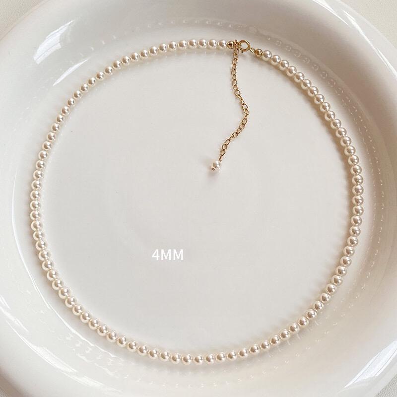Necklace is round white necklace