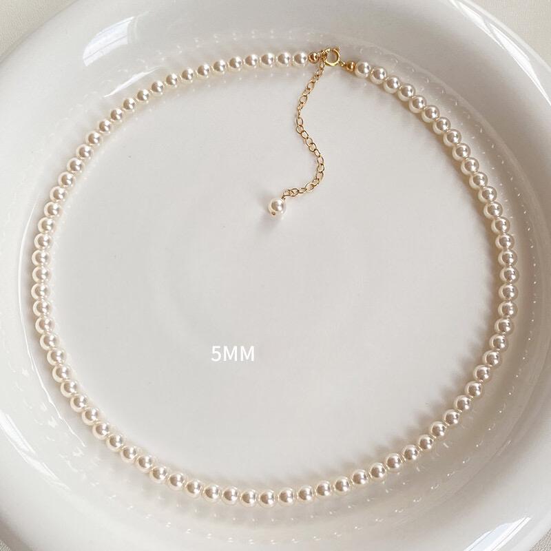 Necklace is round white necklace