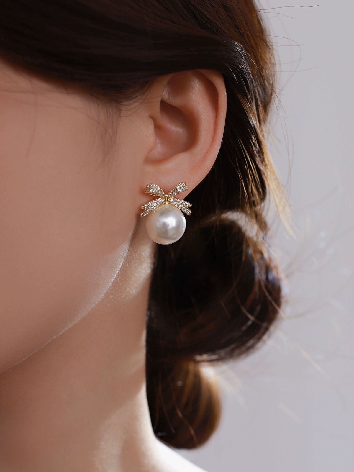 Bow pearl stud earrings women's 2025 new popular Aobai 12mm high-end light luxury texture temperament sterling silver