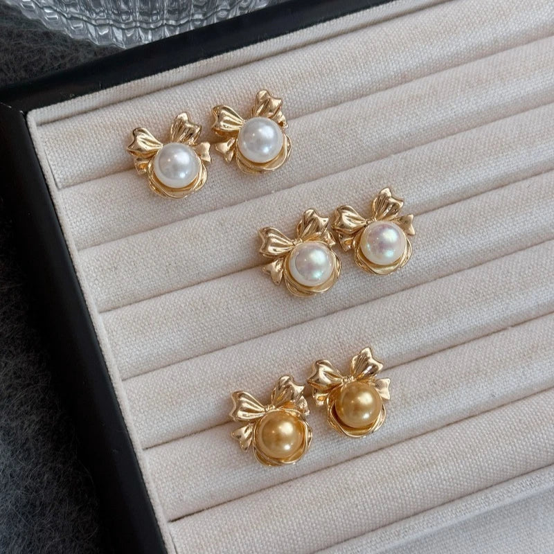 Bow pearl earrings women's 2026 new popular light luxury niche stud earrings, high-end gold Australian white  shell pearl
