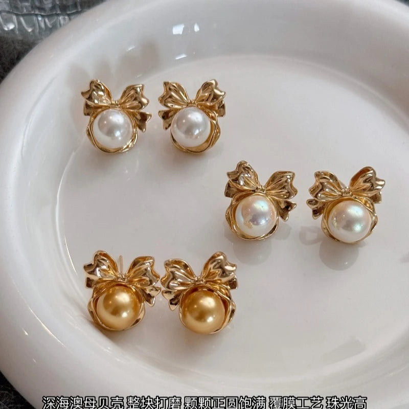 Bow pearl earrings women's 2026 new popular light luxury niche stud earrings, high-end gold Australian white  shell pearl