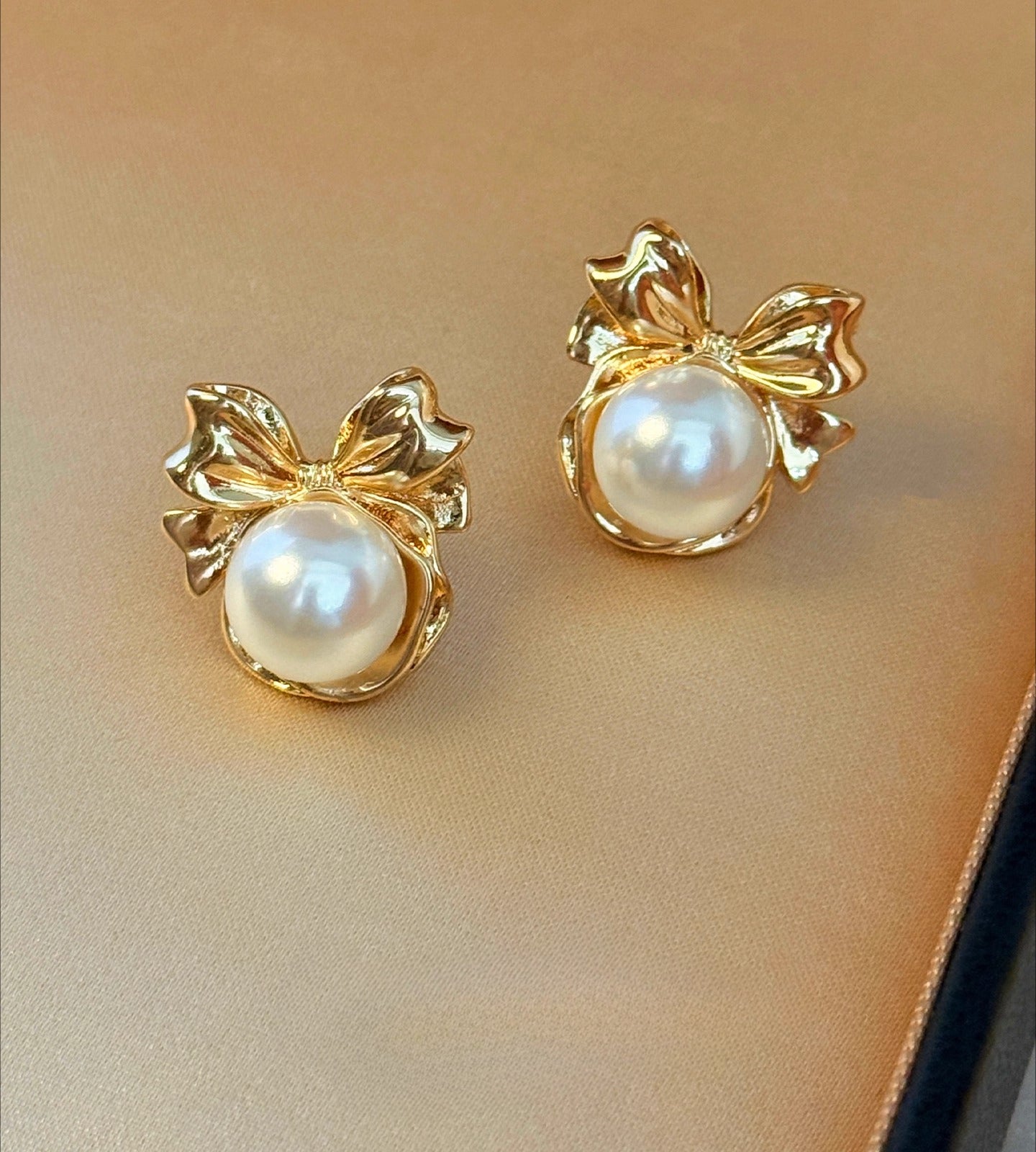 High-End Light Luxury White Pearl Bow Stud Earrings for Women - 2025 Collection