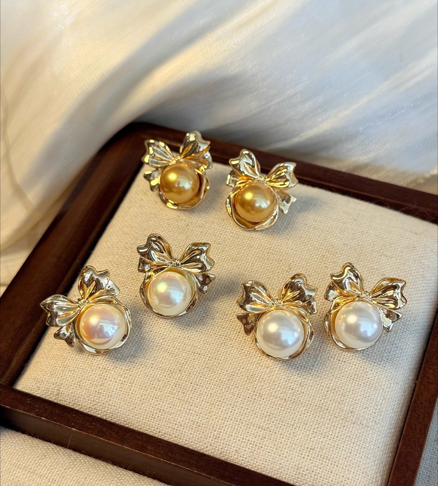 High-End Light Luxury White Pearl Bow Stud Earrings for Women - 2025 Collection