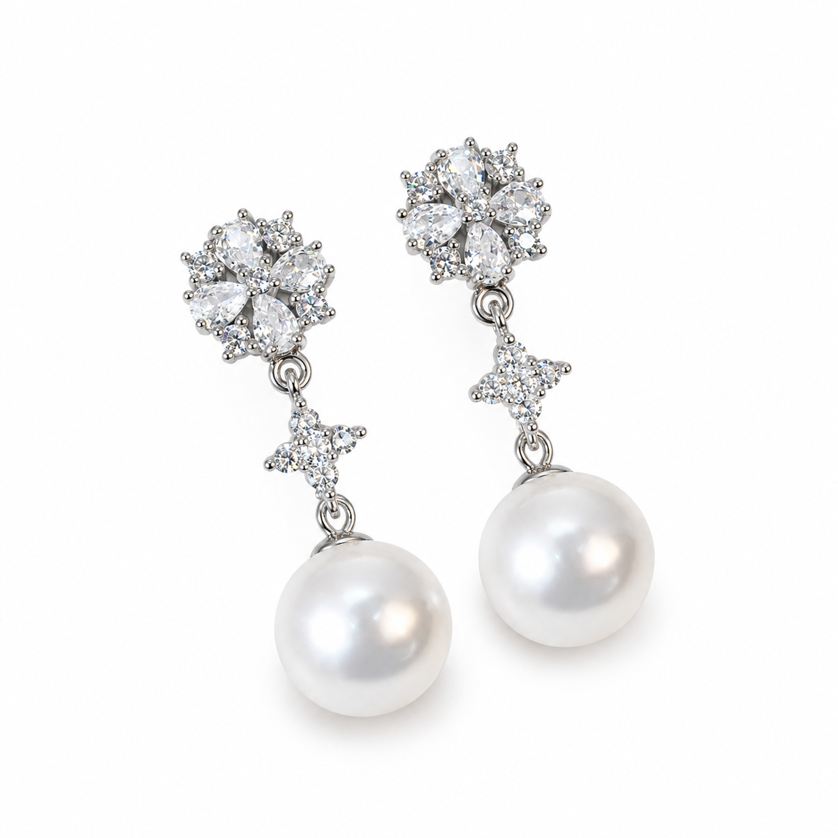 Frostelle shell pearl drop earrings — white pearls with a silver-tone finish on a white background